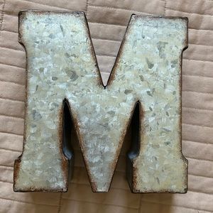 Metal letter ‘M’ standing / hanging